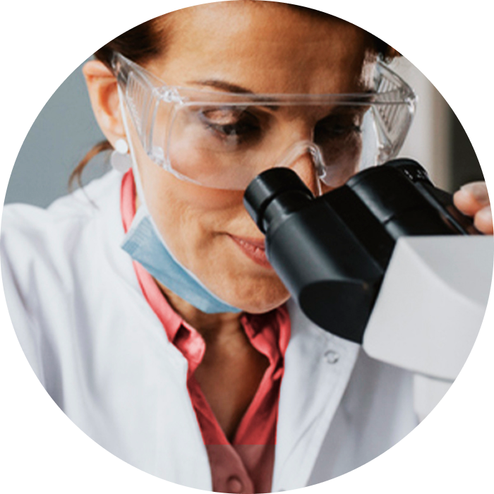Woman looking through a microscope