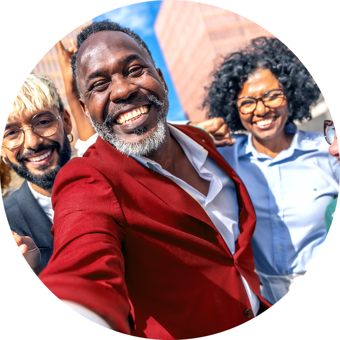 Three people smiling