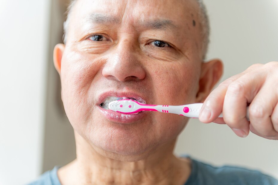 close-man-brushing-his-teeth-tooth