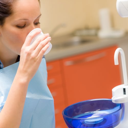 dentist-dental-patient-woman-rinse-mouth