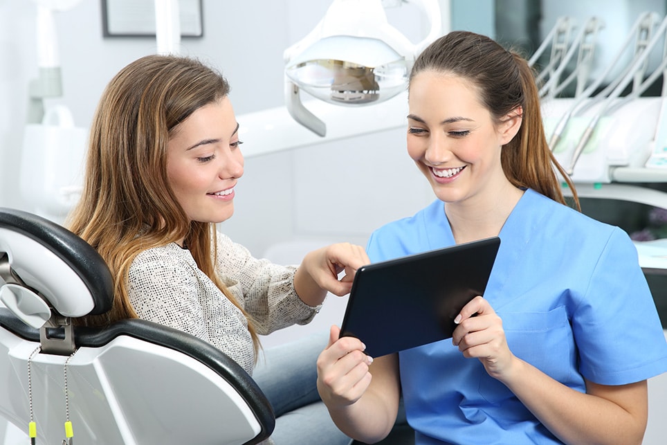 Dentist patient choosing treatment consultation medical