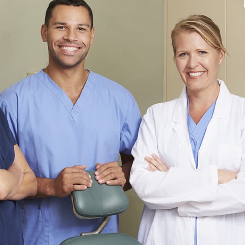 Two nurses and a doctor posing for a picture 