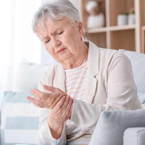 senior-woman-suffering-pain-wrist-home