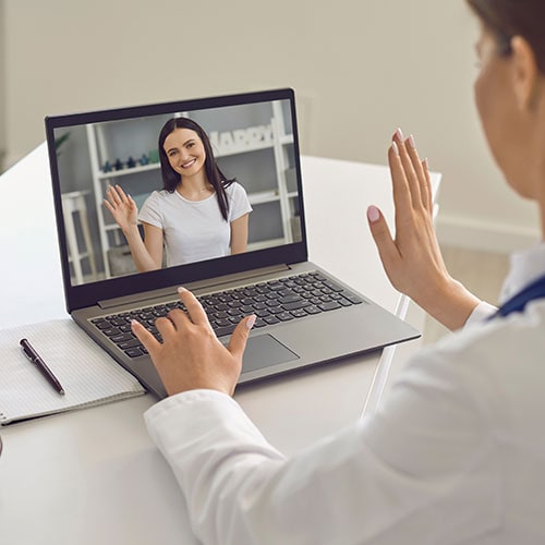 Telemedicine online visiting doctor smiling young